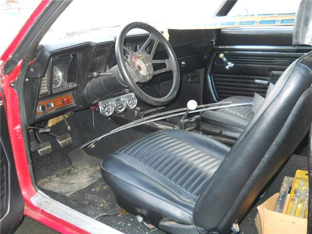 Another view of a car sitting for twenty years under a cover.