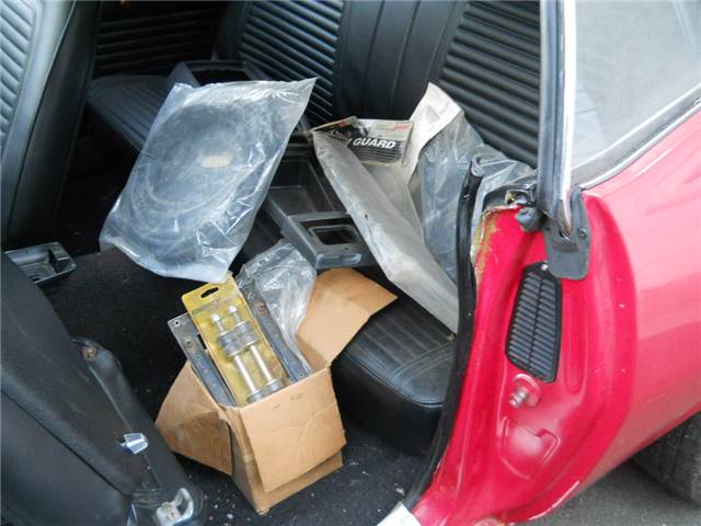 Spare parts collected in the back seat.