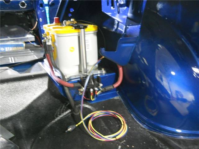 Trunk mounted battery with wiring and cut-out relay with switch.