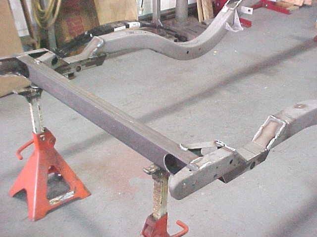 Modification to frame rail made to install relocated shackles.